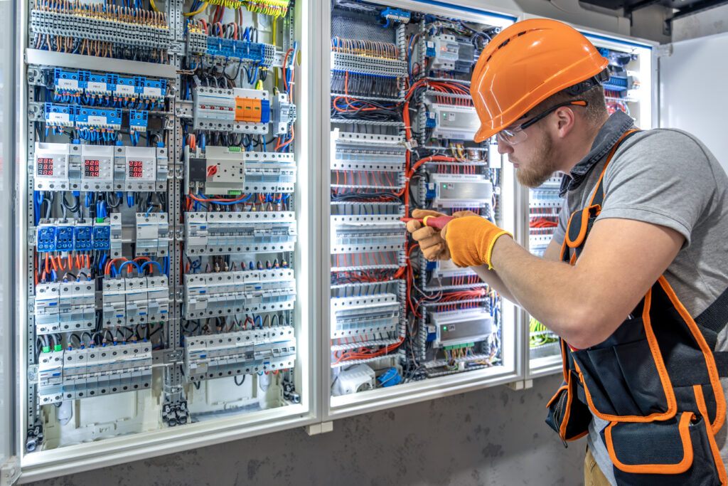 Male electrician working in electrical panel. Male electrician in uniform. High quality photo. Male construction worker in helmet and safety glasses. SSUCv3H4sIAAAAAAAAA41PQY6DMAz8i89BIlBKNl+pegjEUKuBVImz1Qrl71UoVa/r03hsz4w3IAsaVN+Z02moq2mytpISp0rZpq/kpLq2Vz8KmxYEWMMIWratOp9bKTvV9HUpAYOJNILegJxLkYNh8ivoWkDA1WLYIVpiH8g40HUWENlwihhBb1nAaBhnH2jvP3qXrfCgAQTENBSQxT+5qwAz4zr+Ff1cgjg0u93lKuD+ZAzL4e35ViIW+Ag00jofmVJkv7zx6rnc7g7sxzvZ4/j9xo0i+1C8ID2cNxbtMU7DQsyfNuAv4fO7nXN+AQrOQiSEAQAA